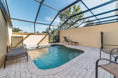 a swimming pool in a house with a glass roof at MSW2505 Windsor Hills 3 Bedroom Private Pool Townhome in Orlando