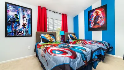 a bedroom with two beds with super heroes at MSW2537 Windsor Hills Resort Vacation Townhome in Orlando