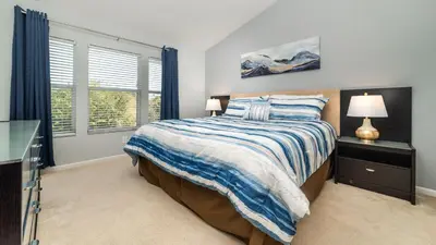 a bedroom with a bed and a window at MSW2537 Windsor Hills Resort Vacation Townhome in Orlando