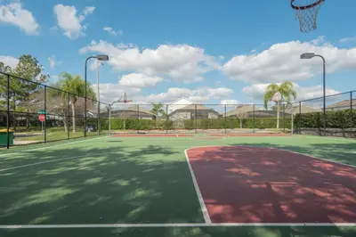 a tennis court with a basketball hoop at Windsor Palm 3 bed Condo in Kissimmee