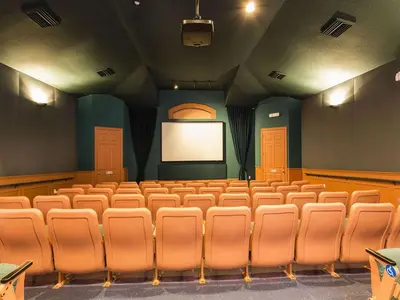 an empty auditorium with a blank screen in a theatre at Windsor Palm 3 bed Condo in Kissimmee