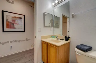a bathroom with a sink and a mirror at Disney Family Fun at Regal Oaks in Orlando