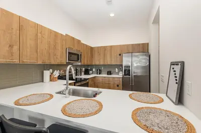 a kitchen with a counter top with a sink at Orlando 2BR Retreat 3 Beds Near Disney&Universal in Orlando
