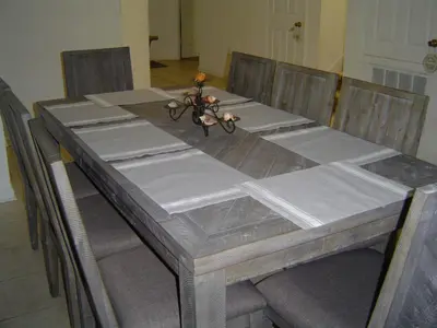 a dining room table with chairs and a table top with a table at Windsor Castle in Orlando