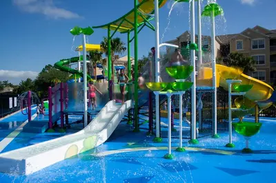 a water park with a water slide and a water slide at Windsor Castle in Orlando
