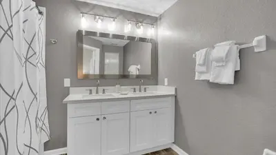 a bathroom with a white sink and a mirror at SKC7679 Windsor Hills Resort Vacation Townhome in Orlando