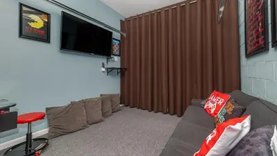 a living room with a couch and a flat screen tv at MNL2683 - Windsor Hills Resort Vacation Home - includes resort clubhouse amenity access in Orlando