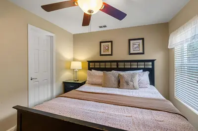 a bedroom with a bed with a ceiling fan at PW2605 Windsor Hills Resort Vacation Home in Orlando