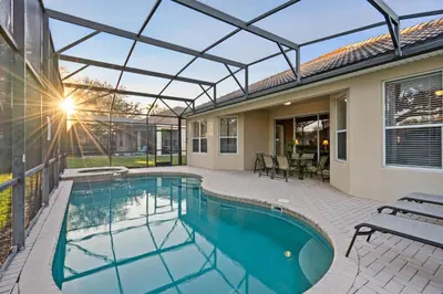 a swimming pool with a glass roof on a house at PW2605 Windsor Hills Resort Vacation Home in Orlando