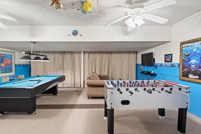 a game room with a pool table and ping pong ball at PW2605 Windsor Hills Resort Vacation Home in Orlando