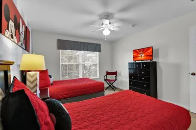 a bedroom with two beds and a dresser at MNL2702 Windsor Hills Resort Vacation Home - includes resort clubhouse amenity access in Orlando