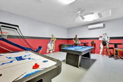 a play room with a ping pong table and a net at MNL2702 Windsor Hills Resort Vacation Home - includes resort clubhouse amenity access in Orlando