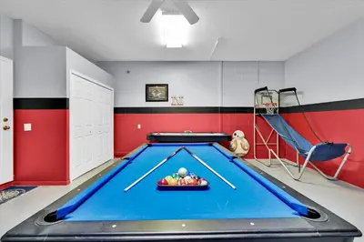 a billiard room with a pool table and a slide at MNL2702 Windsor Hills Resort Vacation Home - includes resort clubhouse amenity access in Orlando
