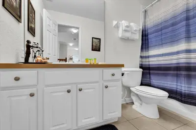 a bathroom with a sink and a toilet and a shower at MNL2702 Windsor Hills Resort Vacation Home in Orlando