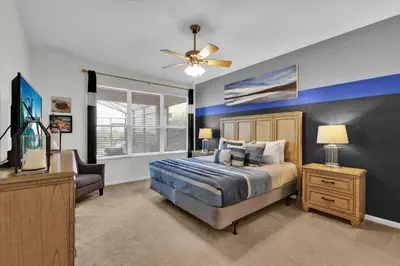 a bedroom with a bed and a ceiling fan at MNL2702 Windsor Hills Resort Vacation Home in Orlando