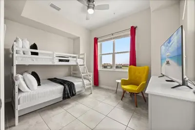 a bedroom with a bunk bed and a desk at 3 Bedrooms 2 Bathrooms Storey Lake 3131-406 in Kissimmee