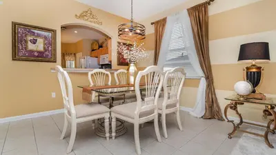 a dining room with a table and chairs at MNL2696 - Windsor Hills Resort Vacation Home - includes resort clubhouse amenity access in Orlando
