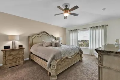 a bedroom with a bed and a ceiling fan at AF2574-Windsor Hills Resort Vacation Home in Orlando
