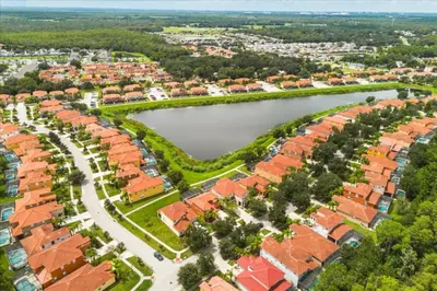 an aerial view of a city with a lake at 4 Bedrooms 5 Bathrooms Bella Vida 871Mb in Kissimmee