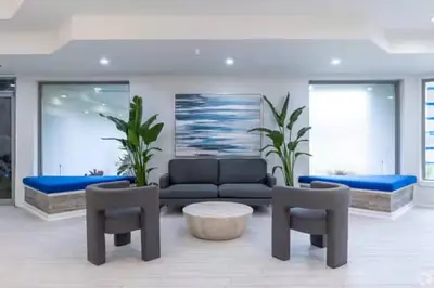 a living room with a couch and two chairs at Aqua Azul Oasis in Kissimmee-minutes from Disney in Kissimmee