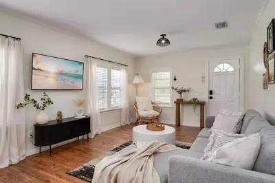 a living room with a couch and a table at Winter Park Gem 2BR Near Parks 3MI to Downtown in Orlando