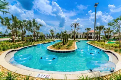 a pool at a resort with blue water at 3141 Paradox Circle 101 in Kissimmee