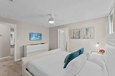 a white bedroom with a bed and a couch at 4824 Resort Pool House Disney Universal Orlando in Kissimmee