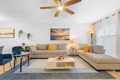 a living room with two couches and a ceiling fan at Magic & Comfort in the Palms!Near Disney-Universal in Kissimmee