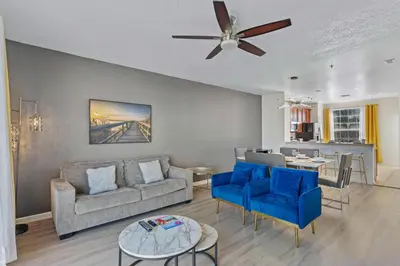 a living room with a couch and a table at 8036 Spacious Fresh 3BR3.5BA at Vista Cay 133 in Orlando