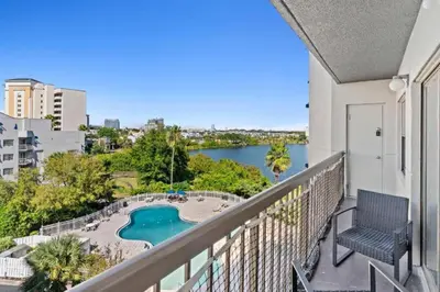 a balcony with a view of a pool at 2701 Enclave Condo near Univesal-Lakeview in Orlando