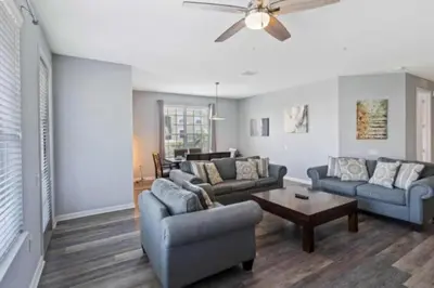 a living room with two couches and a table at 4840 A Hidden Gem in the Heart of Orlando – 303 in Orlando