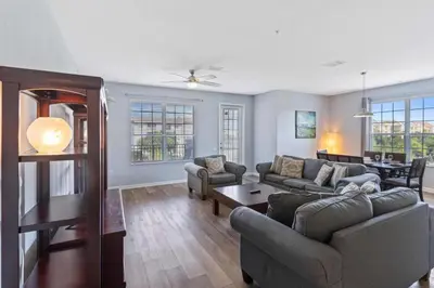 a living room with two couches and a table at 4840 A Hidden Gem in the Heart of Orlando – 303 in Orlando