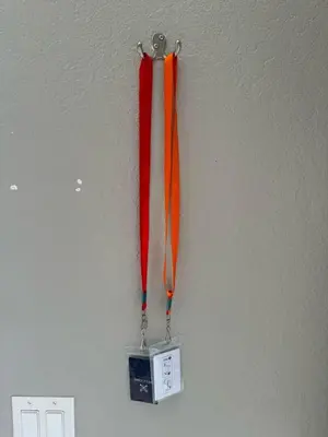a red and orange umbrella hanging on a wall at 4840 A Hidden Gem in the Heart of Orlando – 303 in Orlando