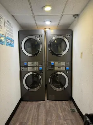 two washing machines are in a laundry room at 3704 Relax Unwind 2-BD 2-BA Resort Condo in Orlando