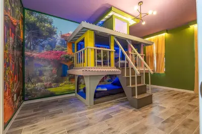 a room with a play house in front of a painting at Stunning Masterpiece 15 ensuites in Kissimmee
