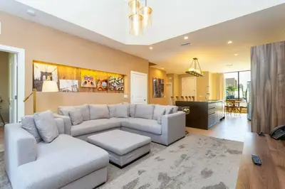a living room with a couch and a table at Modern 4bed townhome in the heart of Kissimmee in Orlando
