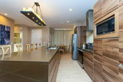 a kitchen with a large island with a counter top at Modern 4bed townhome in the heart of Kissimmee in Orlando