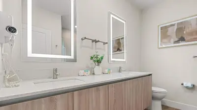a bathroom with a sink and a toilet at Upstay Pristine 3BR Home with Private Pool & BBQ in Orlando