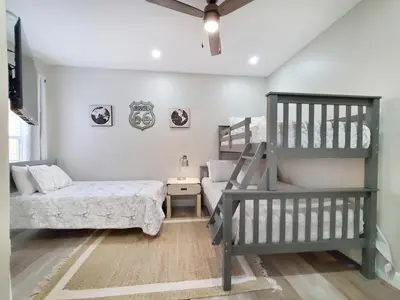 a bedroom with a bunk bed and a ladder at Gated 3BR 3BA Townhome Near Disney w Pool and Gym in Orlando