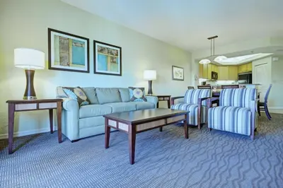 a living room with a couch and chairs and a table at Wyndham Star Island Resort 1BR Apartment with Resort Access in Kissimmee