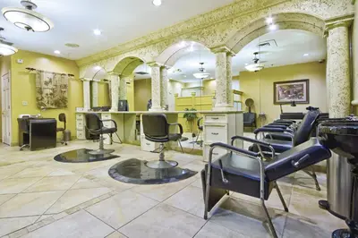 a salon with a row of barber chairs at Wyndham Star Island Resort 1BR Apartment with Resort Access in Kissimmee