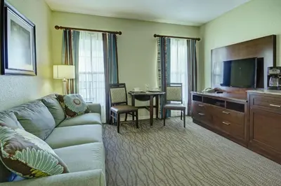 a living room with a couch and a flat screen tv at Wyndham Star Island Resort 3BR Apartment with Resort Access in Kissimmee