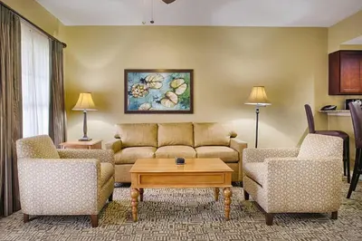 a living room with a couch and two chairs and a table at Wyndham Cypress Palms 1BR Apartment with Resort Access in Kissimmee