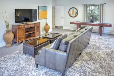 a living room with a couch and a television at Wyndham Cypress Palms 1BR Apartment with Resort Access in Kissimmee