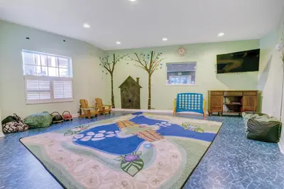 a living room with a large rug on the floor at Wyndham Cypress Palms 1BR Apartment with Resort Access in Kissimmee