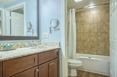 a bathroom with a sink and a toilet and a tub at Wyndham Cypress Palms 1BR Apartment with Resort Access in Kissimmee