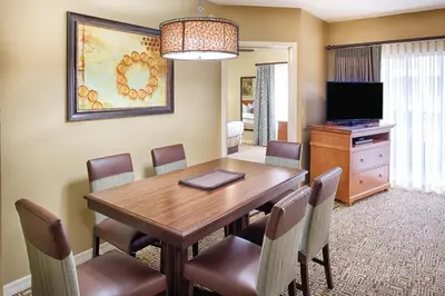 a dining room with a wooden table and chairs at Wyndham Cypress Palms 1BR Apartment with Resort Access in Kissimmee