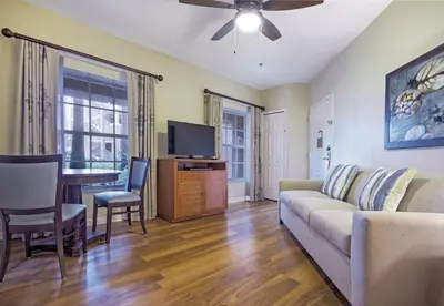 a living room with a couch and a table at Wyndham Cypress Palms 2BR Apartment with Resort Access in Kissimmee