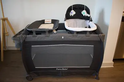 a baby car seat sitting on top of a tv at Modern Oasis with King Bed, Fireworks View, 10 Minutes to Disney in Orlando