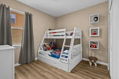 a white bunk bed in a childs bedroom at Family Nest 4-Bedroom Home Near Disney World in Kissimmee